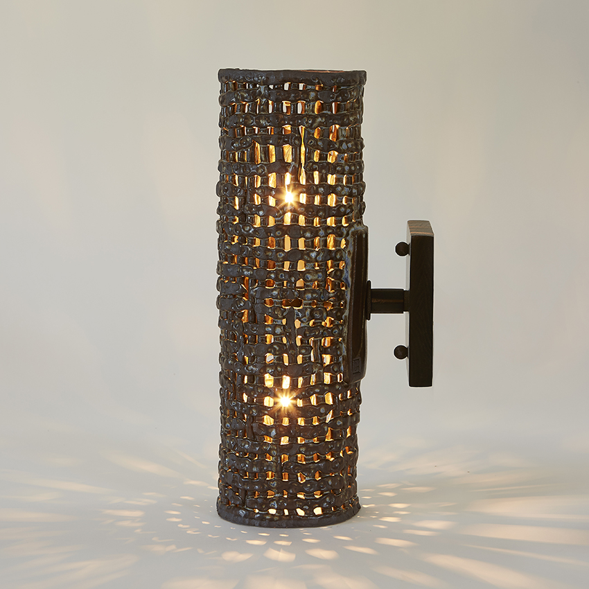 Handmade stoneware Cylinder Basketweave sconces are suitable for both indoor & outdoor use. With a gorgeous basketweave texture, these sconces by Clate Grunden are the perfect addition to any modern interior.