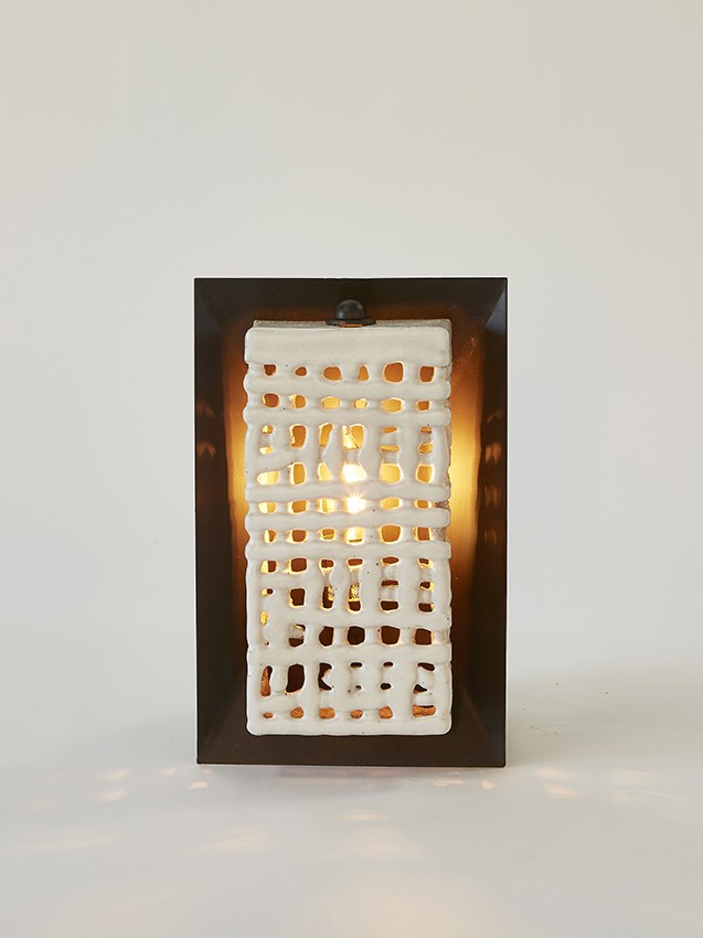 Artisan ceramicist Clate Grunden's Square Basketweave Sconce in white clay with matte white glaze on a bronze backplate offers a mix of materials for modern interior design, available from RUNE, New York.