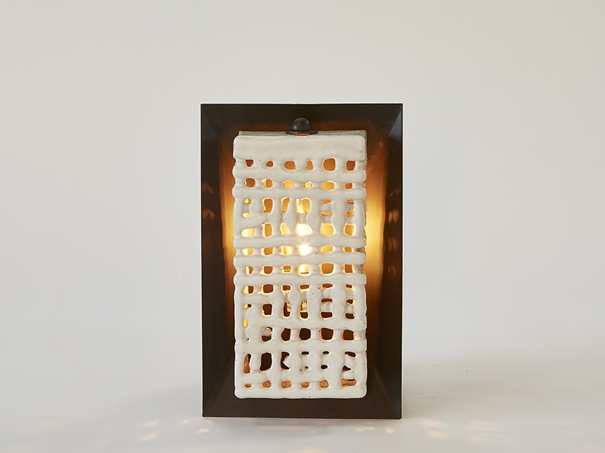 Artisan ceramicist Clate Grunden's Square Basketweave Sconce in white clay with matte white glaze on a bronze backplate offers a mix of materials for modern interior design, available from RUNE, New York.