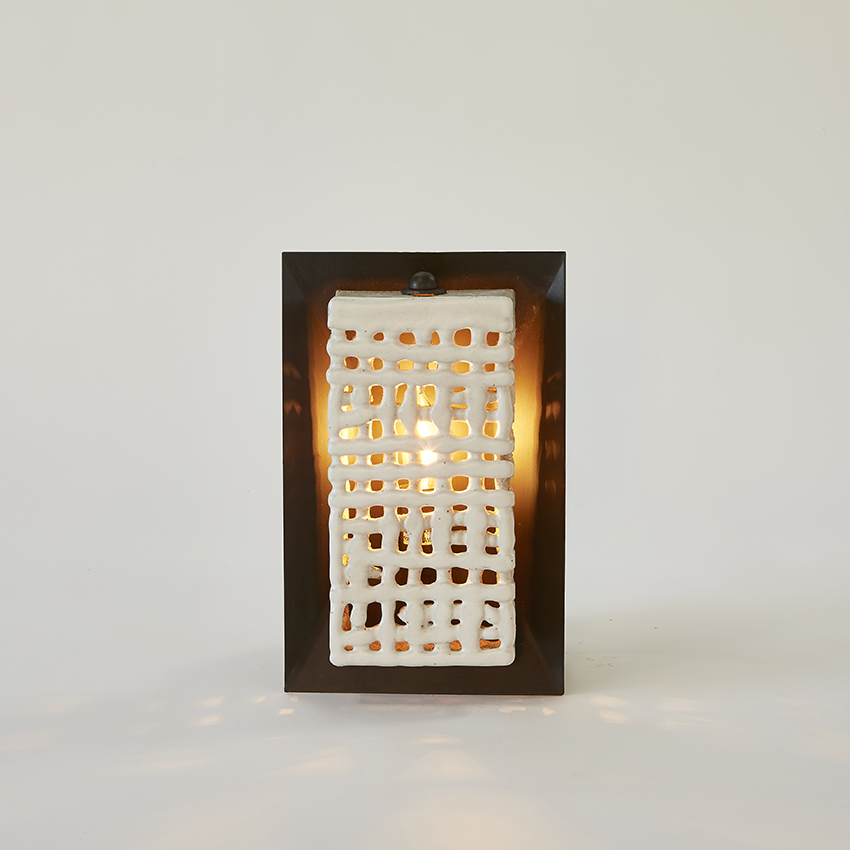Artisan ceramicist Clate Grunden's Square Basketweave Sconce in white clay with matte white glaze on a bronze backplate offers a mix of materials for modern interior design, available from RUNE, New York.