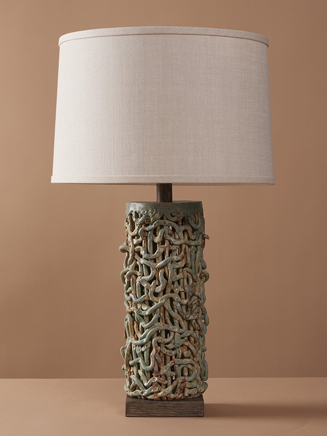 Handmade ceramic Tall Squiggle Weave Lamp combines organic stoneware textures with beach blue glaze to create a modern and artisanal table lamp.