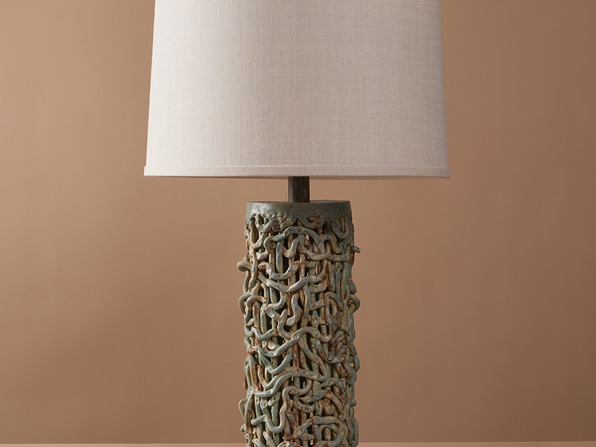Handmade ceramic Tall Squiggle Weave Lamp combines organic stoneware textures with beach blue glaze to create a modern and artisanal table lamp.
