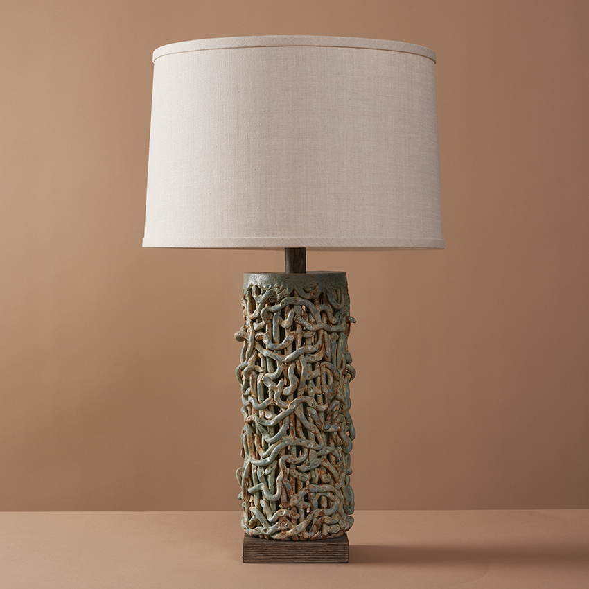 Handmade ceramic Tall Squiggle Weave Lamp combines organic stoneware textures with beach blue glaze to create a modern and artisanal table lamp.