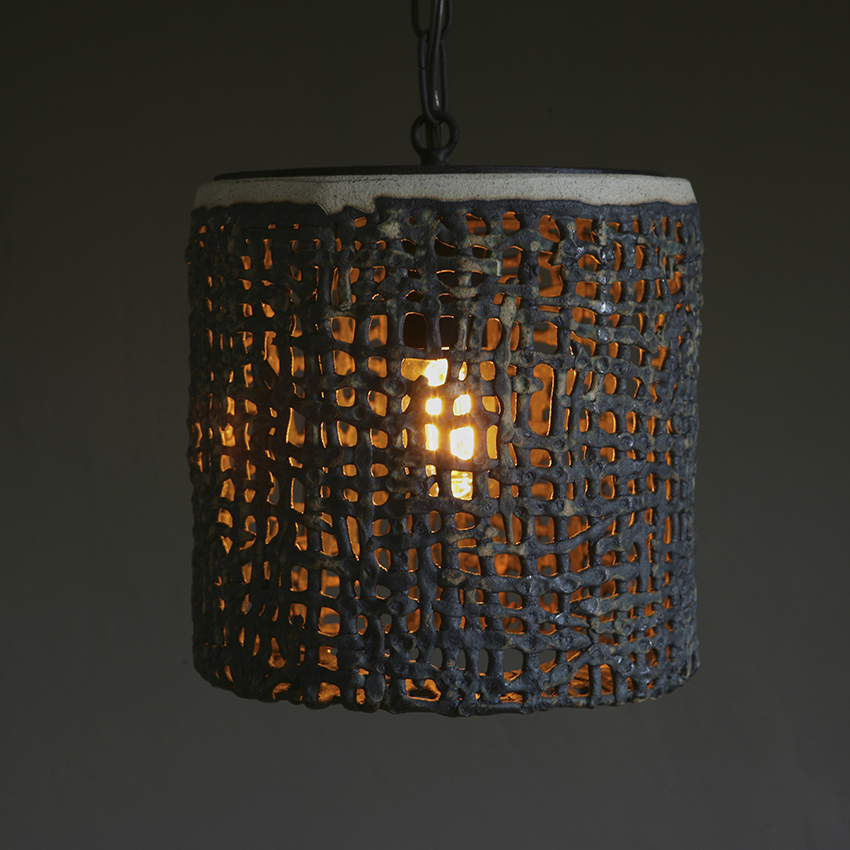 Wide Hanging Basketweave Pendant by ceramicist Clate Grunden in white clay & verdigris glaze offers lighting for indoor & outdoor applications.