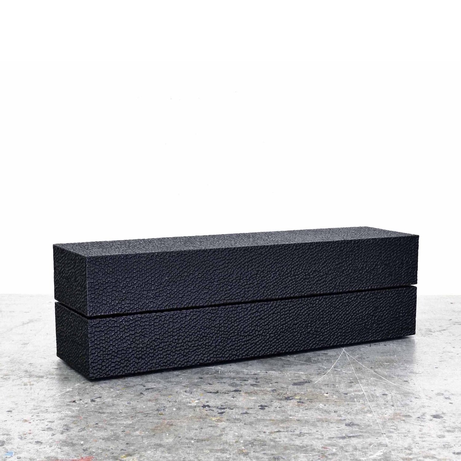 Reveal Bench #1 in carved, blackened maple by John Eric Byers for RUNE, New York.