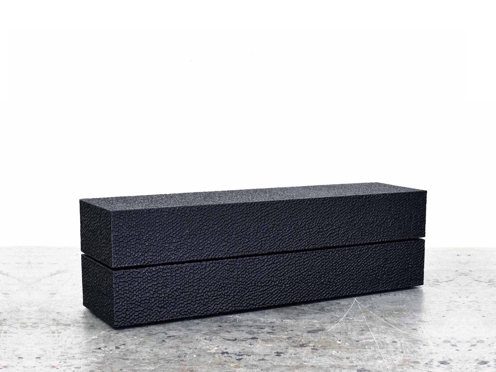 Reveal Bench #1 in carved, blackened maple by John Eric Byers for RUNE, New York.