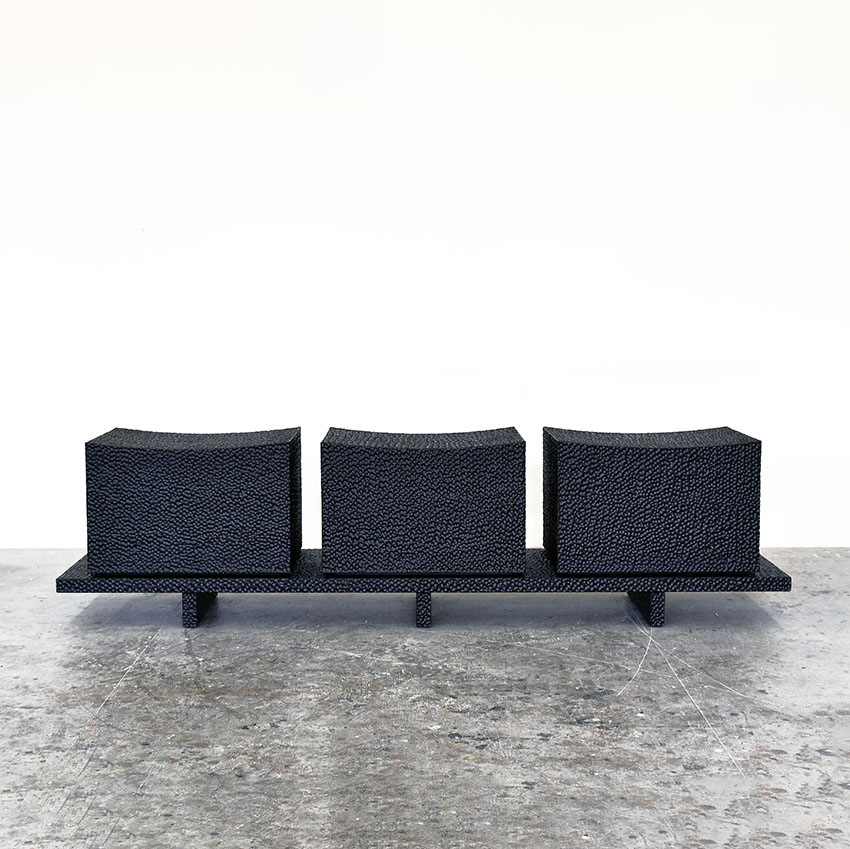 Front view of Loft Bench Revised in carved blackened maple by John Eric Byers for RUNE, New York.