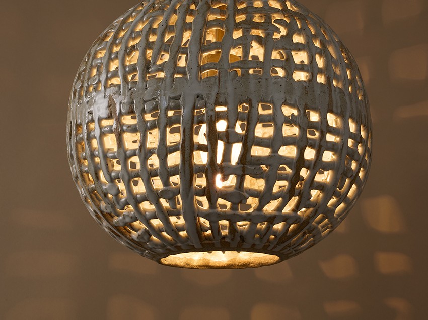 Hand-built & glazed Basketweave Sphere Pendant with woven stoneware texture, suitable for indoor & outdoor applications by ceramicist Clate Grunden, shown in white clay with matte white glaze & antique brass French chain. Available from RUNE, New York.