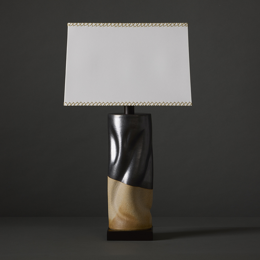 High contrast, sculptural artisan stoneware table lamp in white clay & matte black glaze by ceramic artist Clate Grunden, available from RUNE, New York, offers a striking aesthetic for modern interiors.
