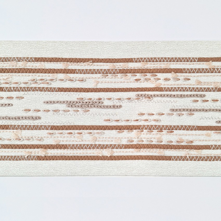 P+L Studio embroidery, handmade in France, with precise decorative stitching in different textural materials applied in a modern, linear pattern.